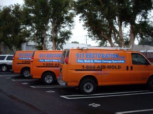 911 Restoration vans in parking lot